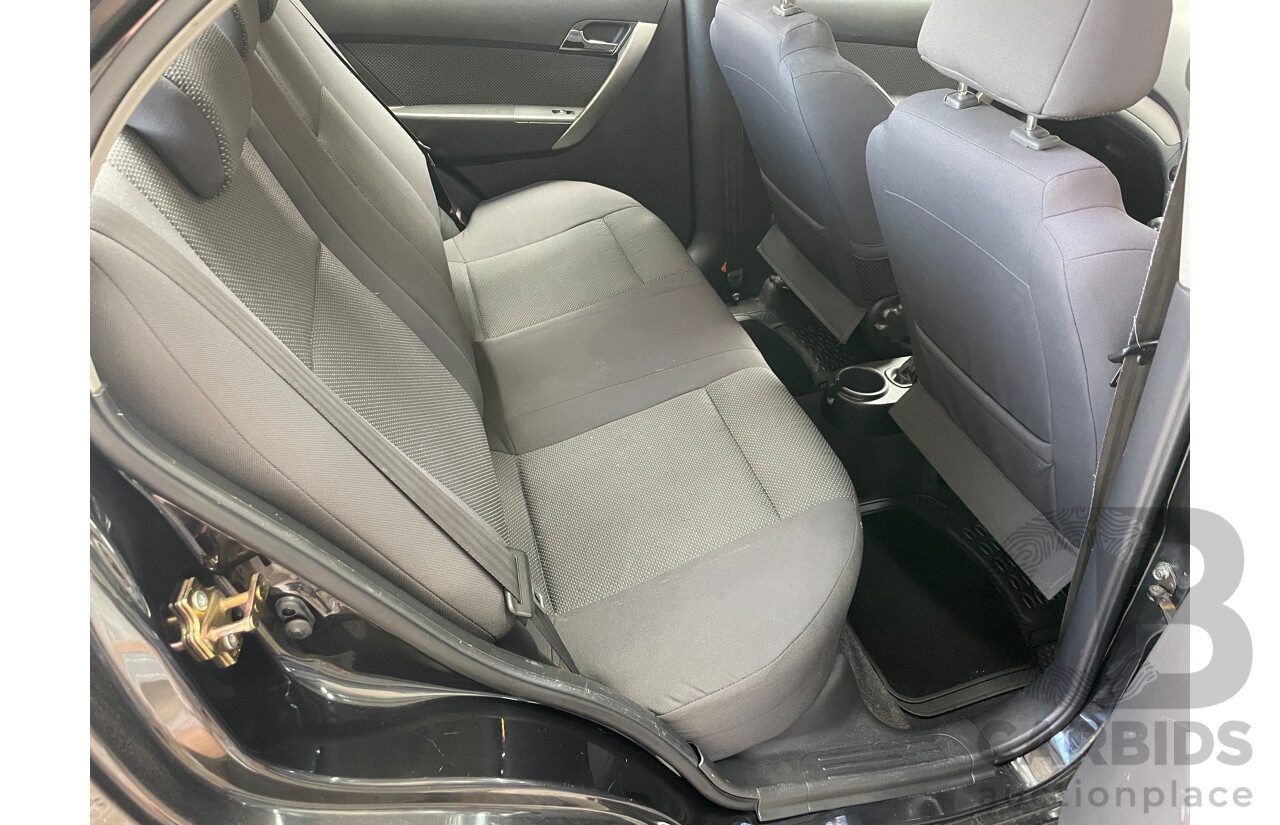 10/2006 Holden Barina  TK 4d Sedan Black 1.6L