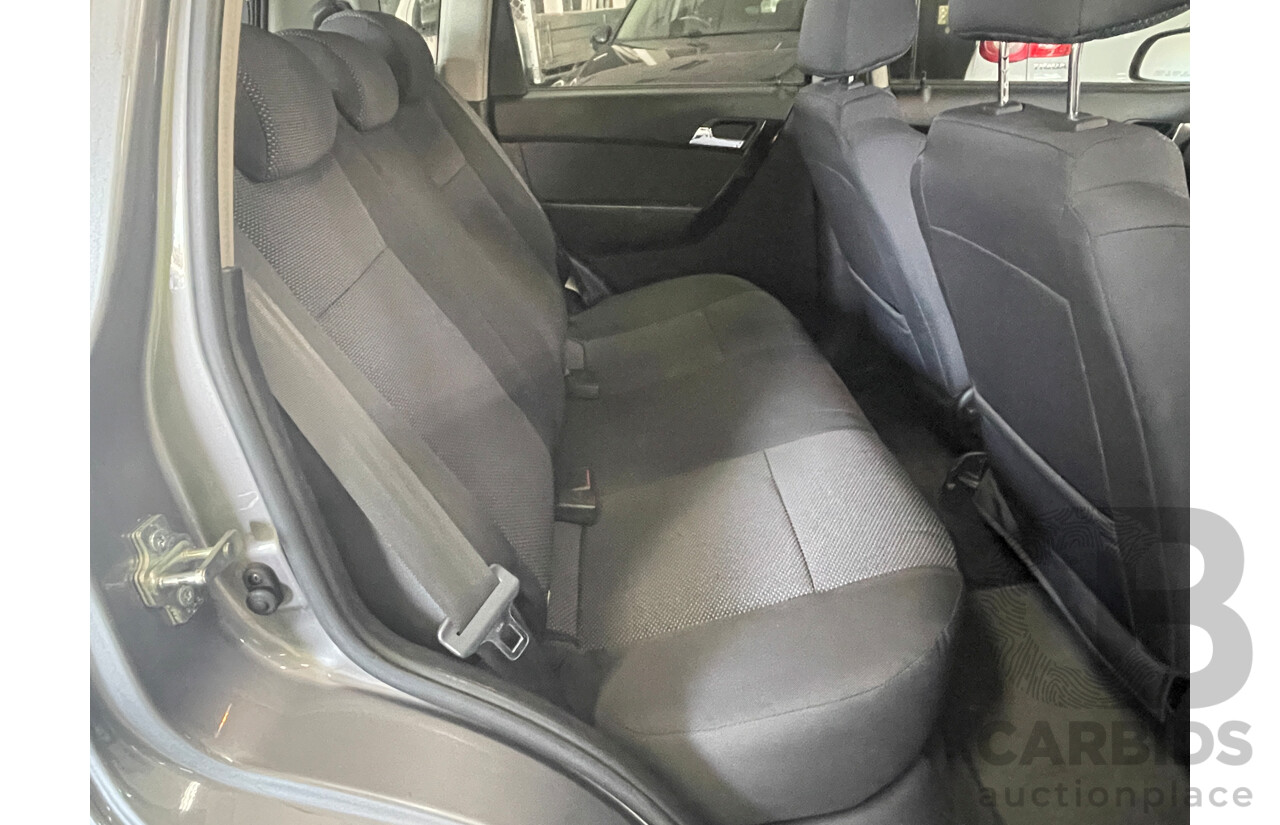 7/2010 Holden Barina  TK MY10 5d Hatchback Grey 1.6L