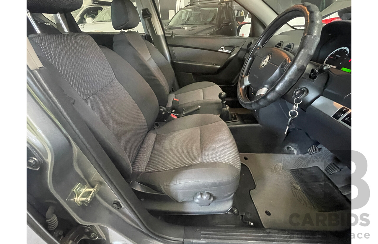 7/2010 Holden Barina  TK MY10 5d Hatchback Grey 1.6L