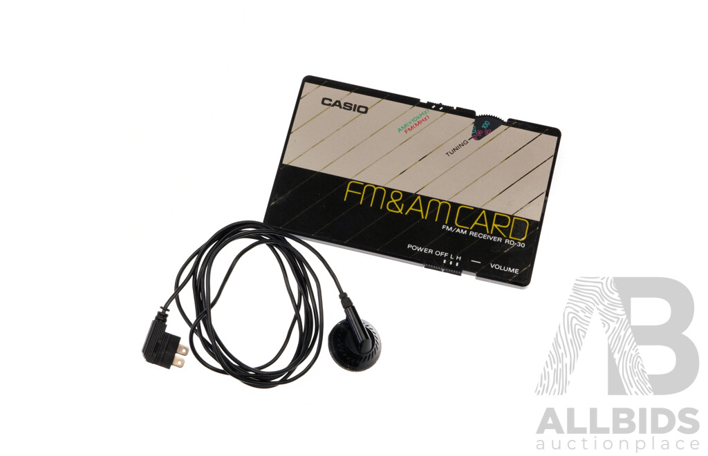 Vintage Casio FM and AM Card Receiver and Headphone