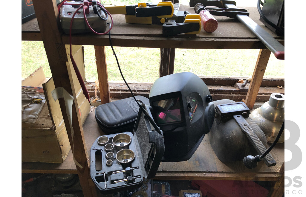 Assorted Contents on Middle Shelf Including, Levels, Hole Saw Bits, Welding Helmets, Industrial Lights and More