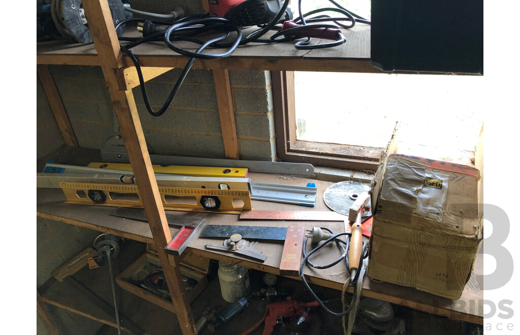Assorted Contents on Middle Shelf Including, Levels, Hole Saw Bits, Welding Helmets, Industrial Lights and More