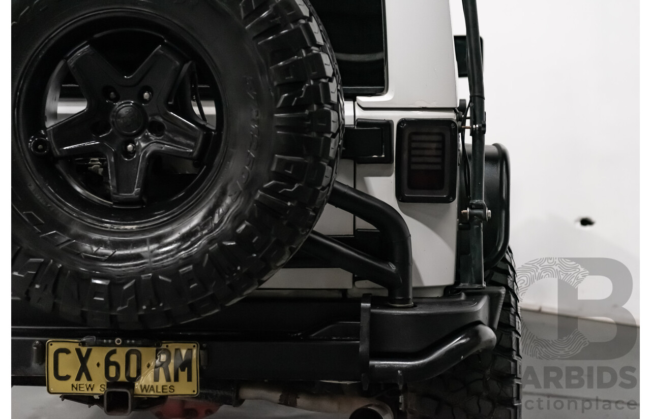 3/2011 Jeep Wrangler Unlimited Rubicon (4x4) JK MY11 4d Softtop White 3.8L - Modified