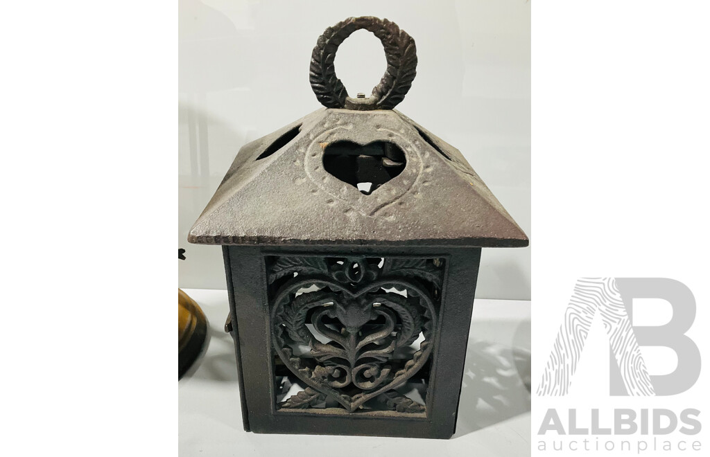 Collection of Vintage Outdoor Hangers Including Cast Iron Candle Holders, Cow Bell, Bird Feeder and Wind Chimes