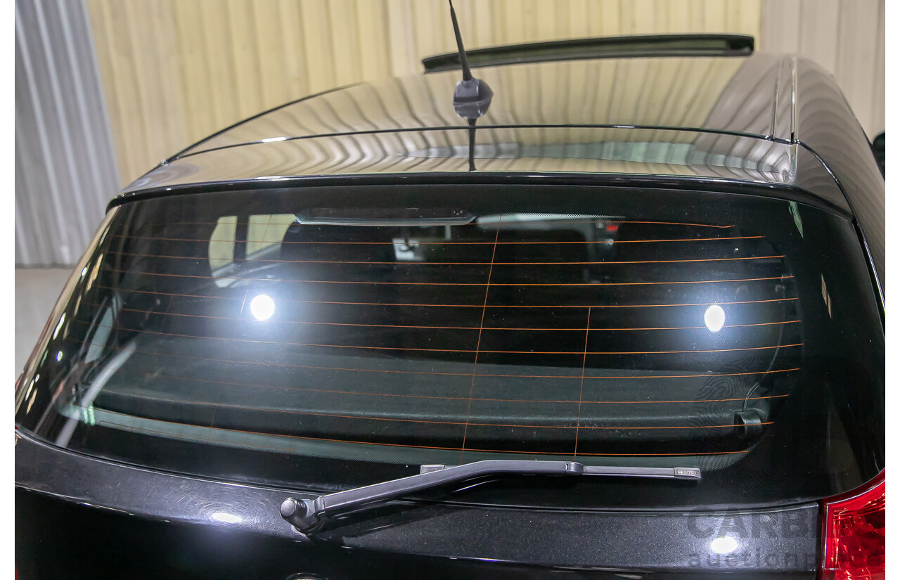 6/2010 BMW 118i E87 MY10 5d Hatchback Black 2.0L