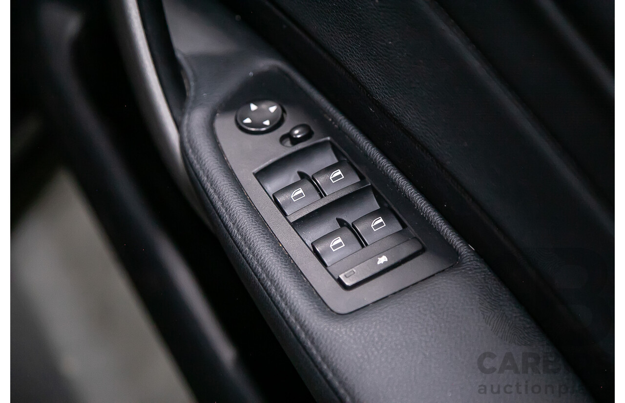 6/2010 BMW 118i E87 MY10 5d Hatchback Black 2.0L