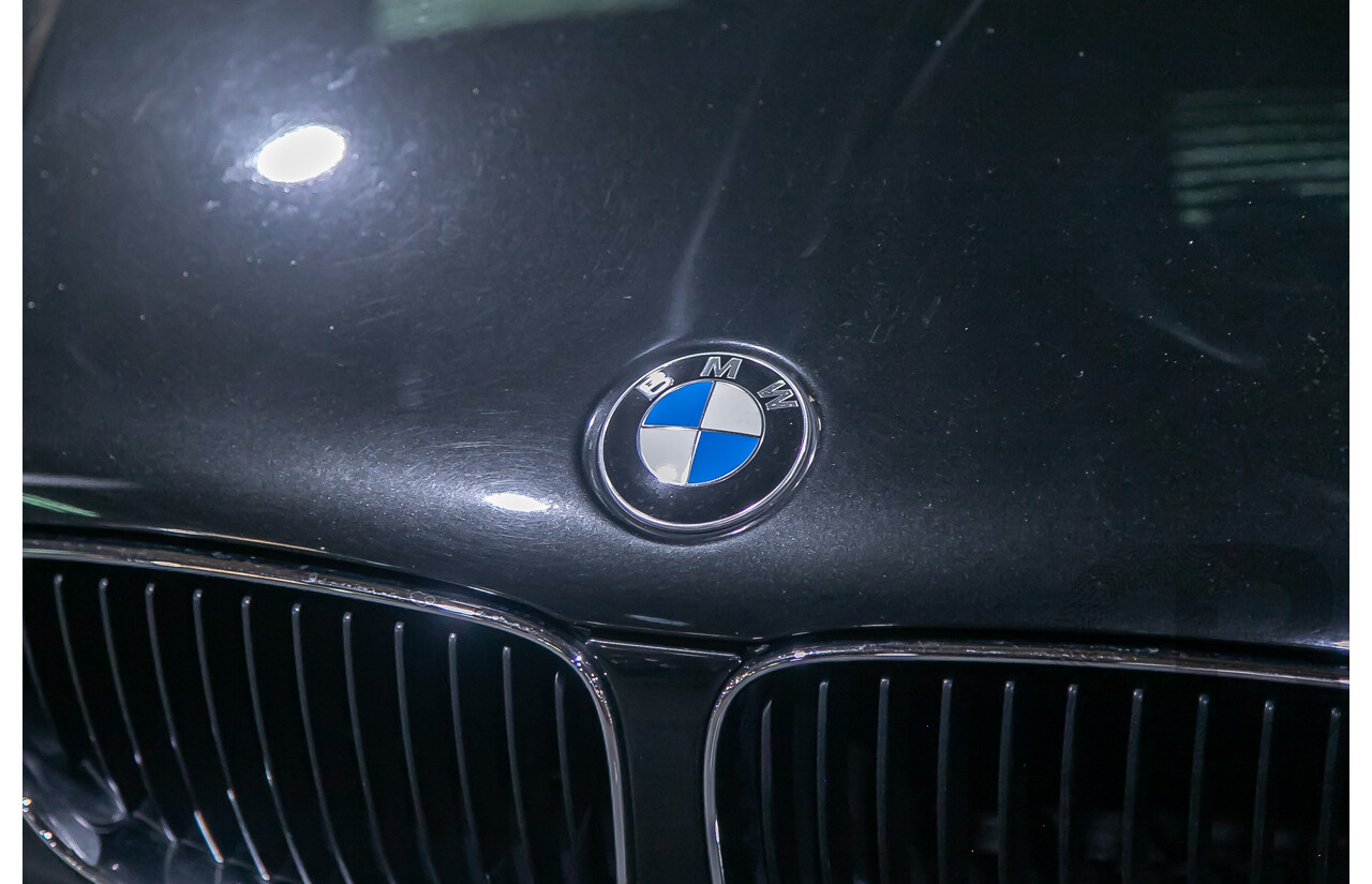 6/2010 BMW 118i E87 MY10 5d Hatchback Black 2.0L