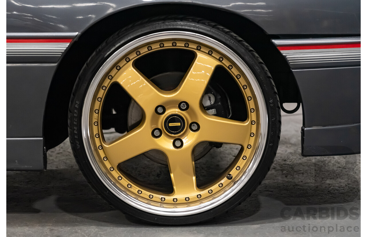 3/1990 Holden Commodore SS VN 4d Sedan A9F Atlas Grey V8 5.0L