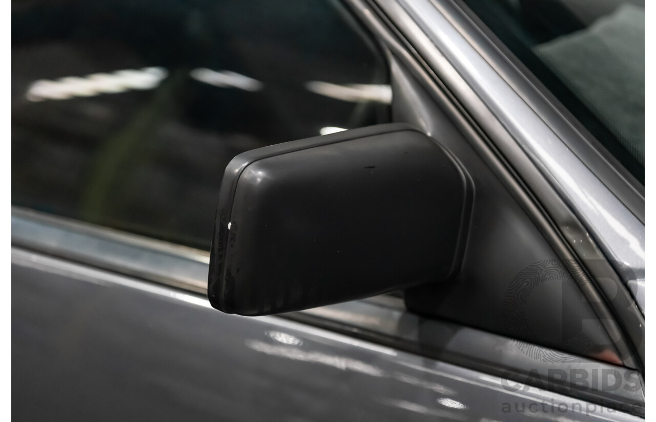 3/1990 Holden Commodore SS VN 4d Sedan A9F Atlas Grey V8 5.0L