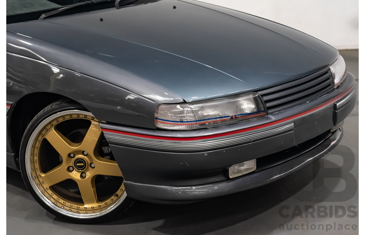 3/1990 Holden Commodore SS VN 4d Sedan A9F Atlas Grey V8 5.0L