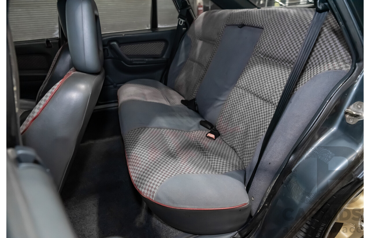 3/1990 Holden Commodore SS VN 4d Sedan A9F Atlas Grey V8 5.0L