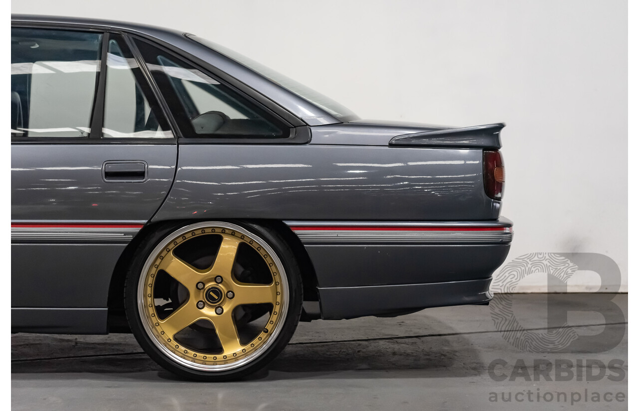 3/1990 Holden Commodore SS VN 4d Sedan A9F Atlas Grey V8 5.0L