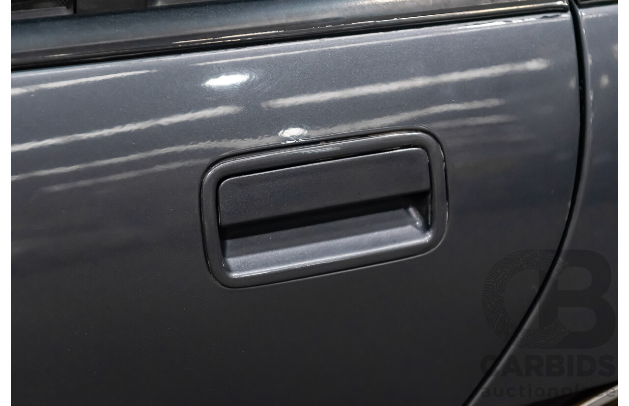 3/1990 Holden Commodore SS VN 4d Sedan A9F Atlas Grey V8 5.0L