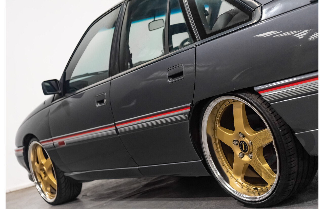 3/1990 Holden Commodore SS VN 4d Sedan A9F Atlas Grey V8 5.0L
