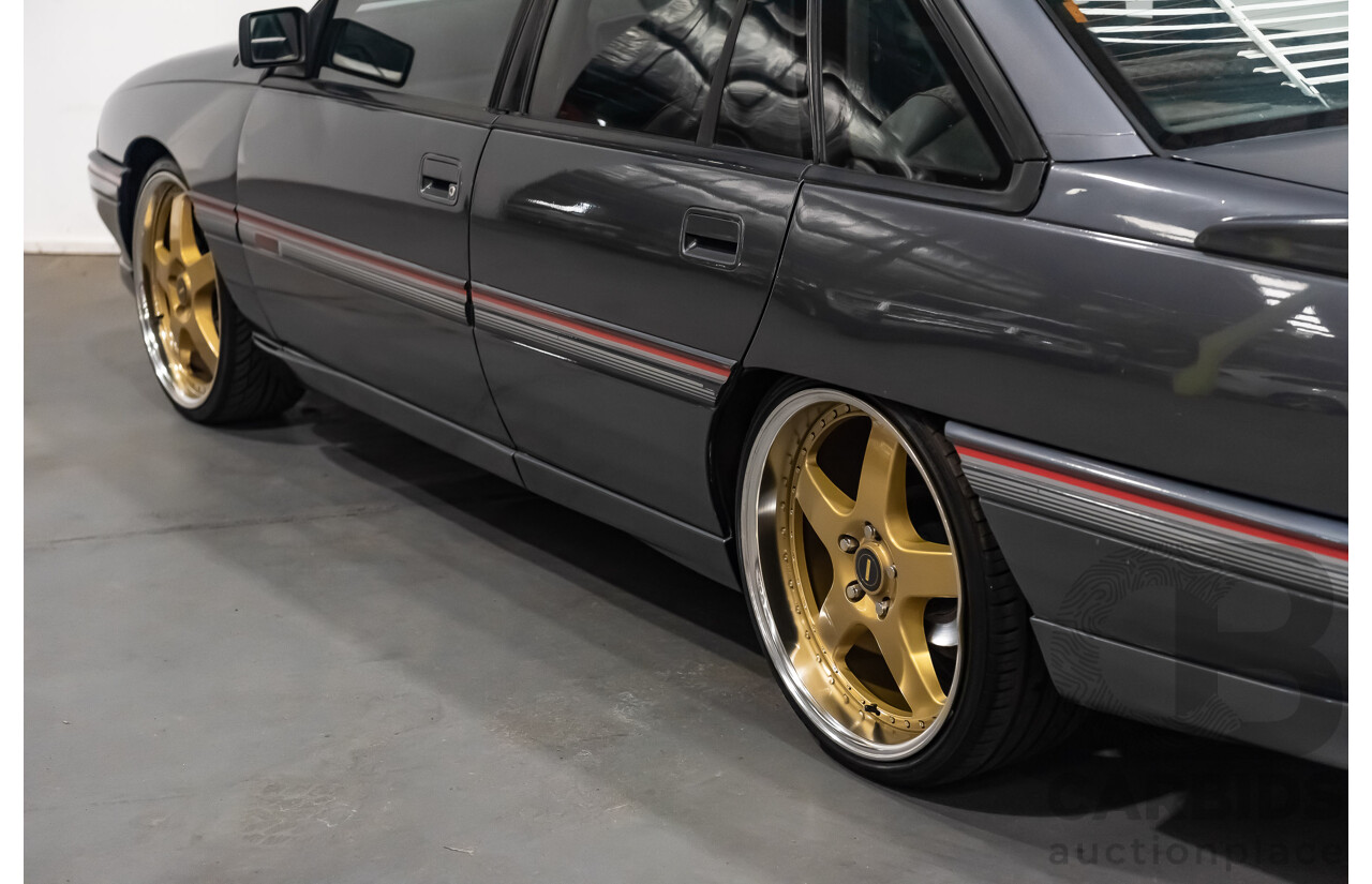 3/1990 Holden Commodore SS VN 4d Sedan A9F Atlas Grey V8 5.0L