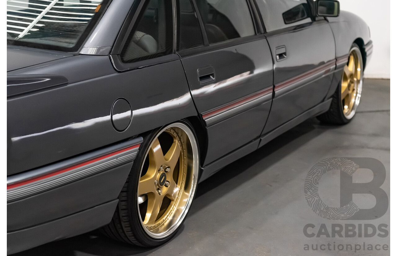 3/1990 Holden Commodore SS VN 4d Sedan A9F Atlas Grey V8 5.0L