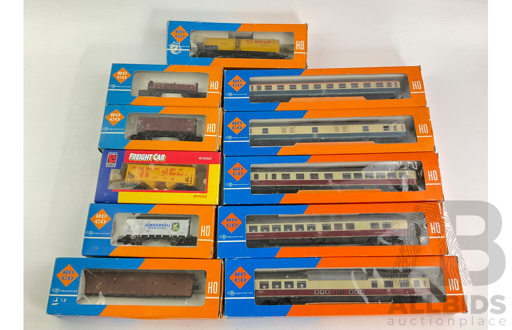 Vintage Collection of Boxed Roco HO Scale Rolling Stock Including Five German DB Passenger Cars, German and American Freight Wagons and Tanker