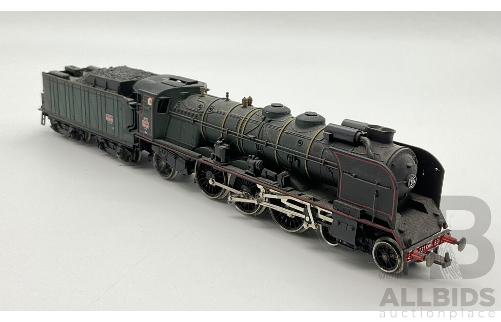 Three HO Scale Locomotives Including Steam Locomotives SCNF 231.2.82, Mainline 75001 and Lima Santa Fe Diesel Locomotive 106