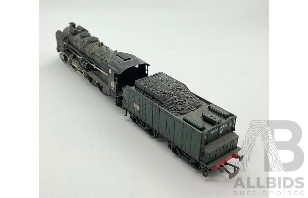 Three HO Scale Locomotives Including Steam Locomotives SCNF 231.2.82, Mainline 75001 and Lima Santa Fe Diesel Locomotive 106