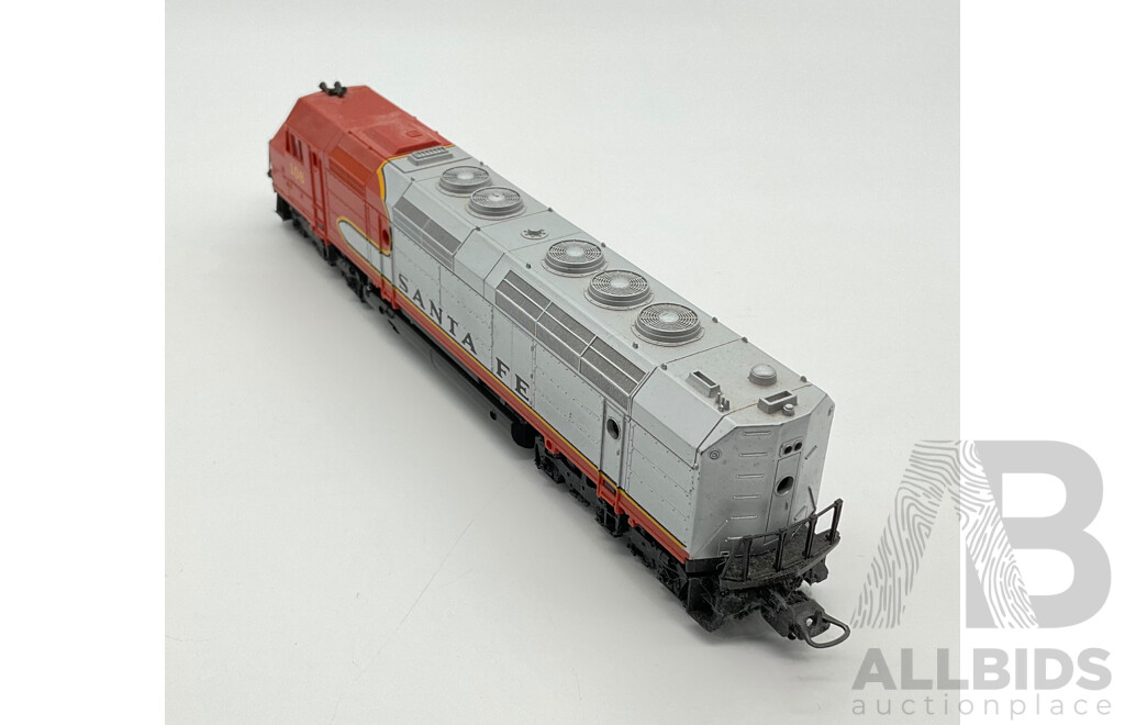 Three HO Scale Locomotives Including Steam Locomotives SCNF 231.2.82, Mainline 75001 and Lima Santa Fe Diesel Locomotive 106