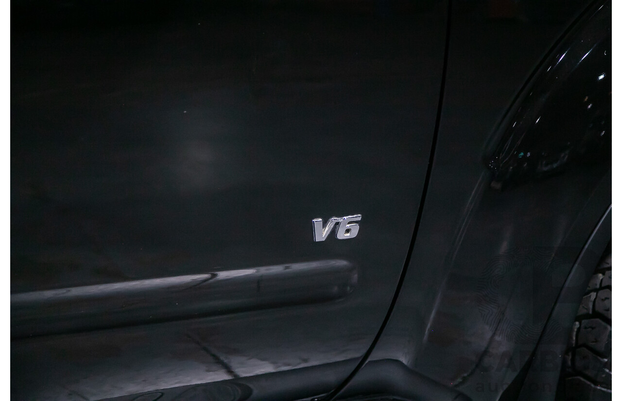 1/2012 Nissan Navara ST-X 550 (4x4) D40 MY12 Dual Cab Utility Black Turbo Diesel V6 3.0L