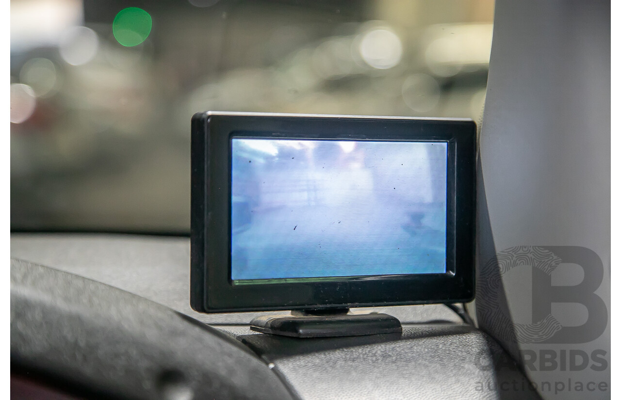 1/2012 Nissan Navara ST-X 550 (4x4) D40 MY12 Dual Cab Utility Black Turbo Diesel V6 3.0L