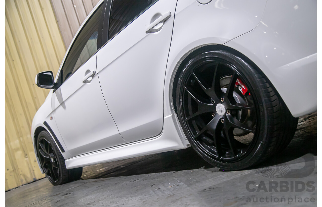 8/2010 Mitsubishi Lancer Ralliart (AWD) CJ MY10 4d Sedan White Turbo 2.0L