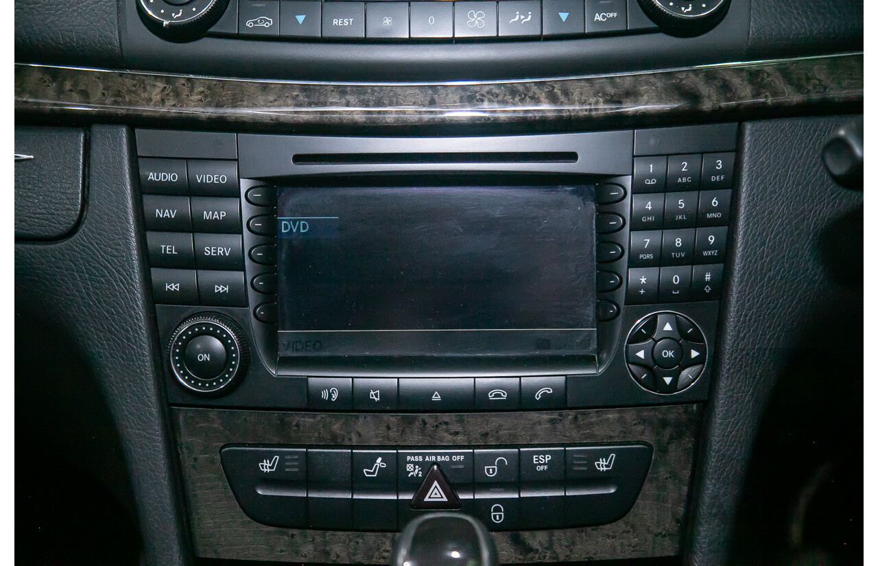 10/2004 Mercedes Benz E55 AMG W211 4d Sedan Brilliant Silver Metallic Supercharged V8 5.4L