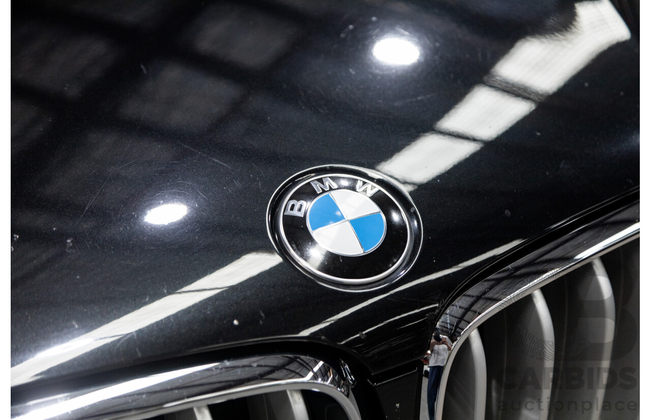 11/2013 BMW X5 xDrive30d (AWD) F15 4D Wagon Metallic Black Turbo Diesel 3.0L - 7 Seater