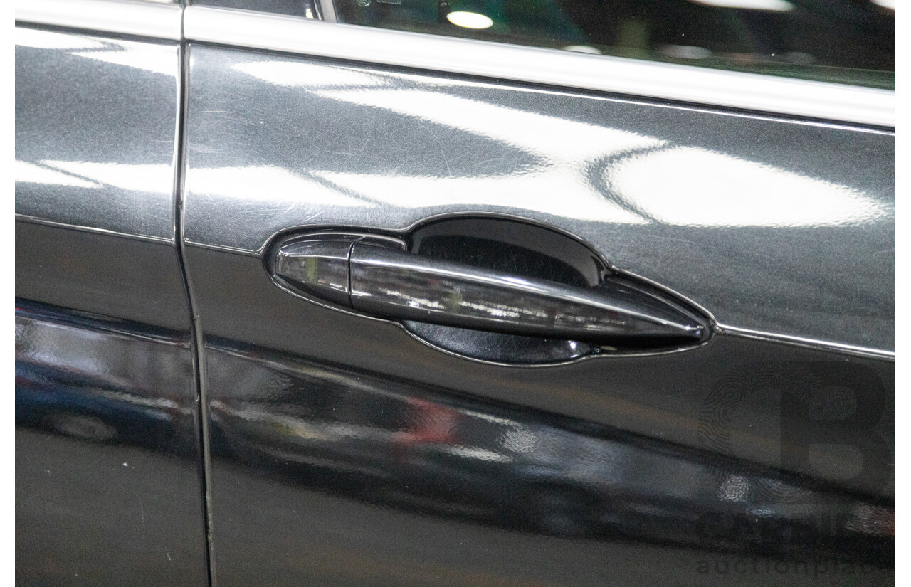 11/2013 BMW X5 xDrive30d (AWD) F15 4D Wagon Metallic Black Turbo Diesel 3.0L - 7 Seater