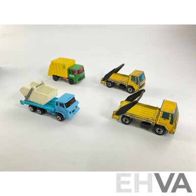 Assortment of Diecast Tow Trucks and Garbage Trucks Including Hot Wheels and Matchbox Battle Kings