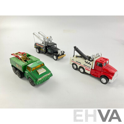 Assortment of Diecast Tow Trucks and Garbage Trucks Including Hot Wheels and Matchbox Battle Kings