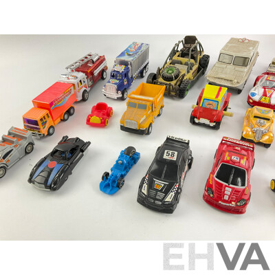 Assortment of Plastic Toy Vehicles Incuding Trucks, Trains and Race Cars