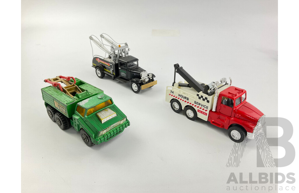 Assortment of Diecast Tow Trucks and Garbage Trucks Including Hot Wheels and Matchbox Battle Kings