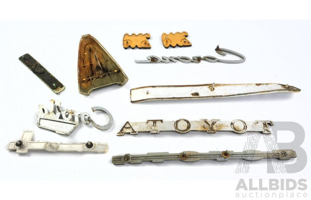 Collection of Vintage Toyota Badges Including Stout, Corolla, Corona, 2300, Toyoglide
