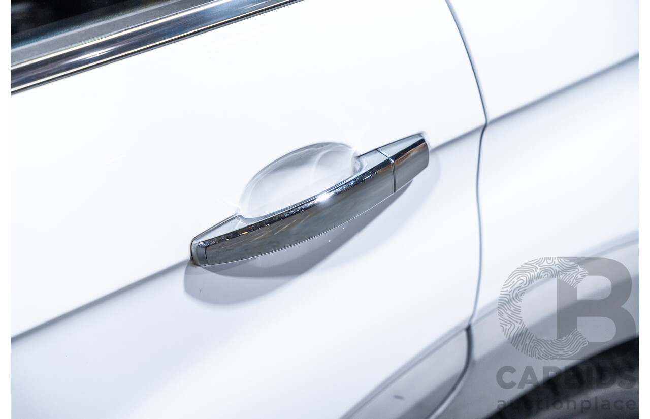 12/2012 Holden Captiva 7 LX (4x4) Series 2 CG MY12 4d Wagon White Turbo Diesel 2.2L - 7 Seater