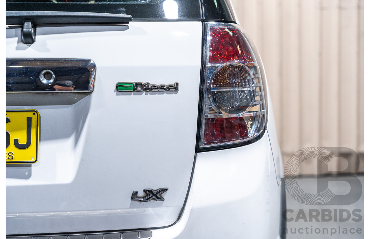 12/2012 Holden Captiva 7 LX (4x4) Series 2 CG MY12 4d Wagon White Turbo Diesel 2.2L - 7 Seater