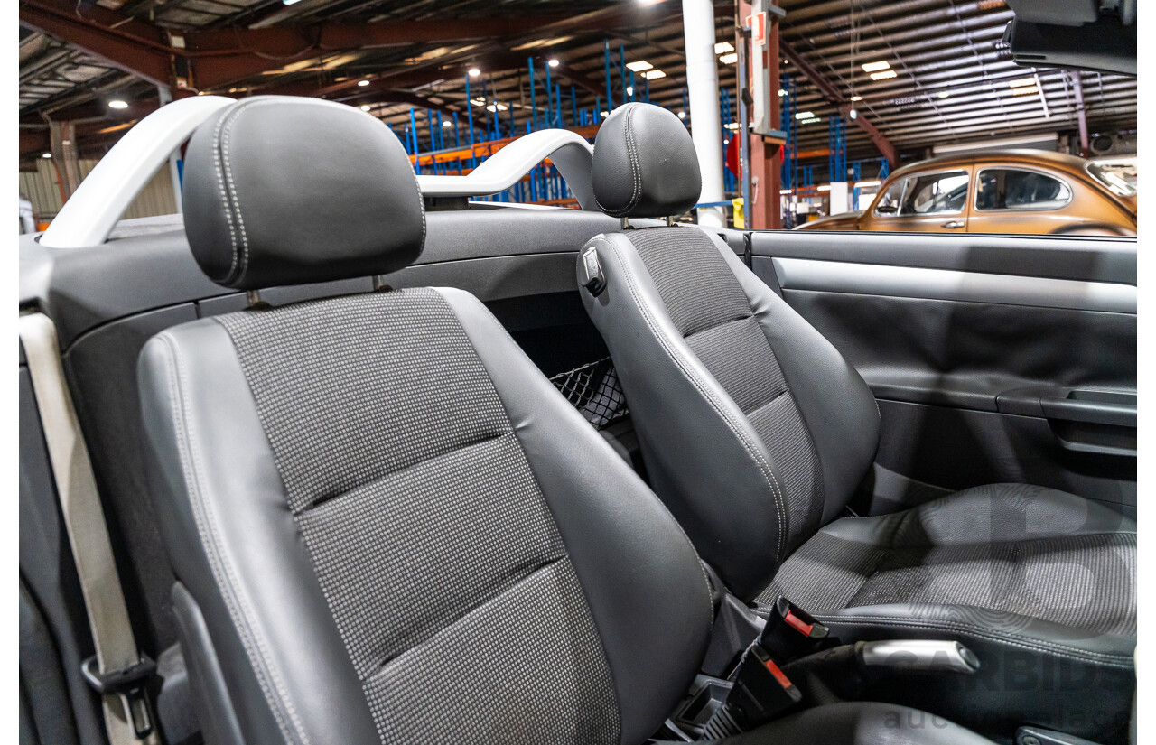 1/2006 Holden Tigra  XC MY06 2d Convertible Metallic Silver 1.8L