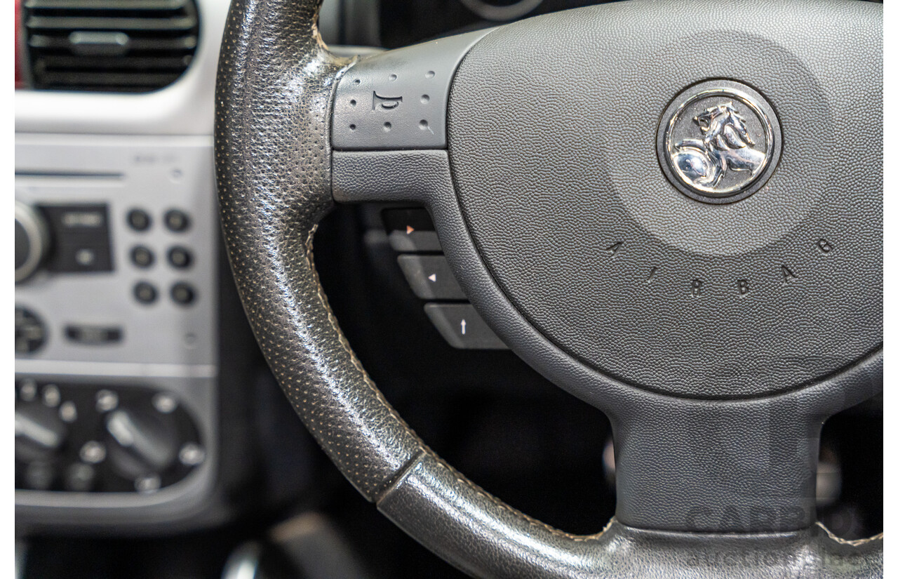 1/2006 Holden Tigra  XC MY06 2d Convertible Metallic Silver 1.8L