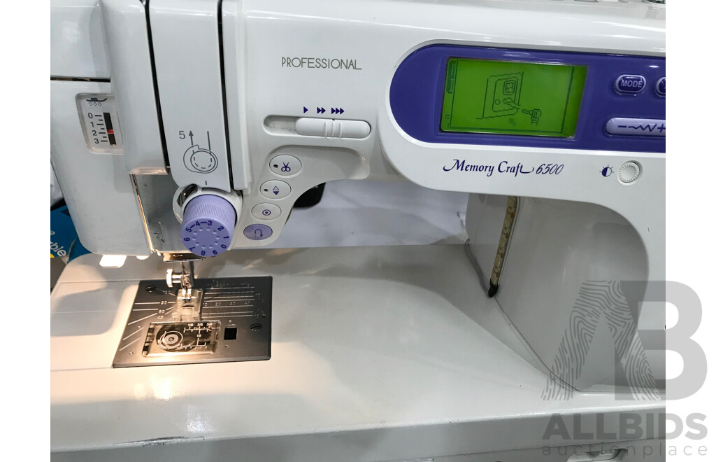 Janome Memory Craft 6500 Professional Sewing Machine with Table and Accessories