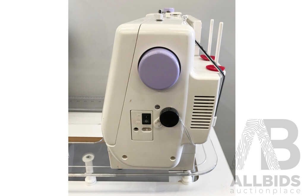 Janome Memory Craft 6500 Professional Sewing Machine with Table and Accessories