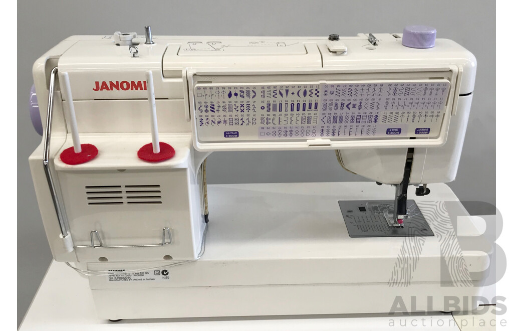 Janome Memory Craft 6500 Professional Sewing Machine with Table and Accessories
