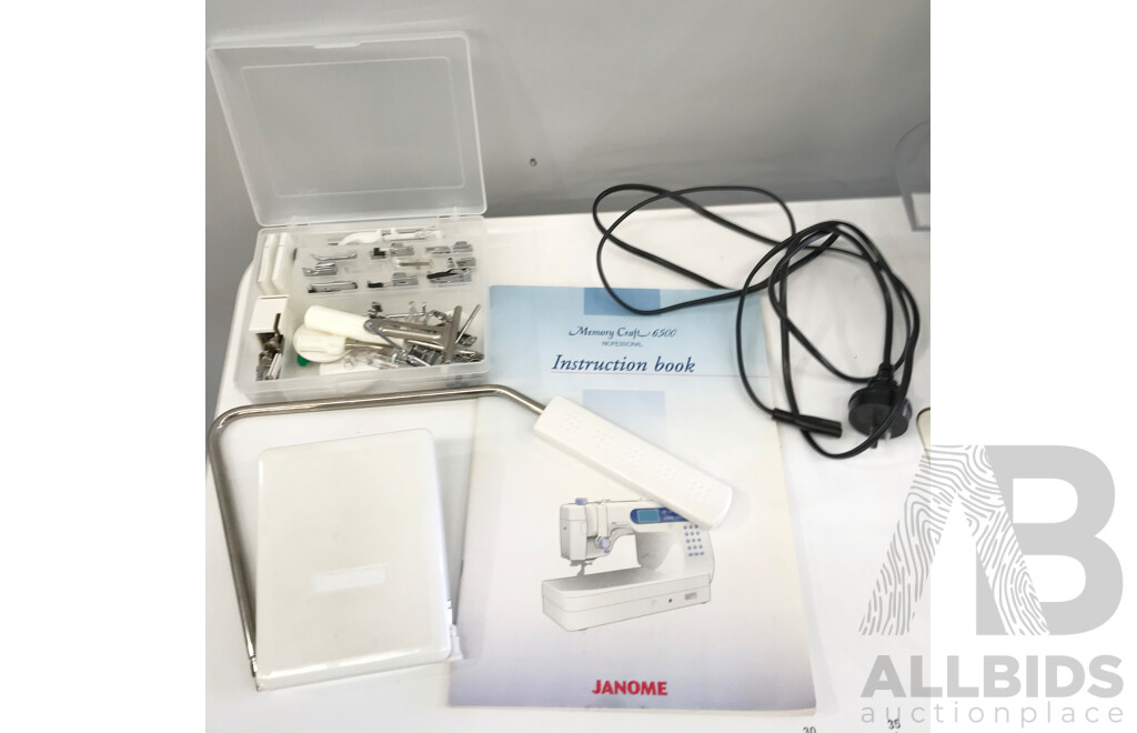 Janome Memory Craft 6500 Professional Sewing Machine with Table and Accessories