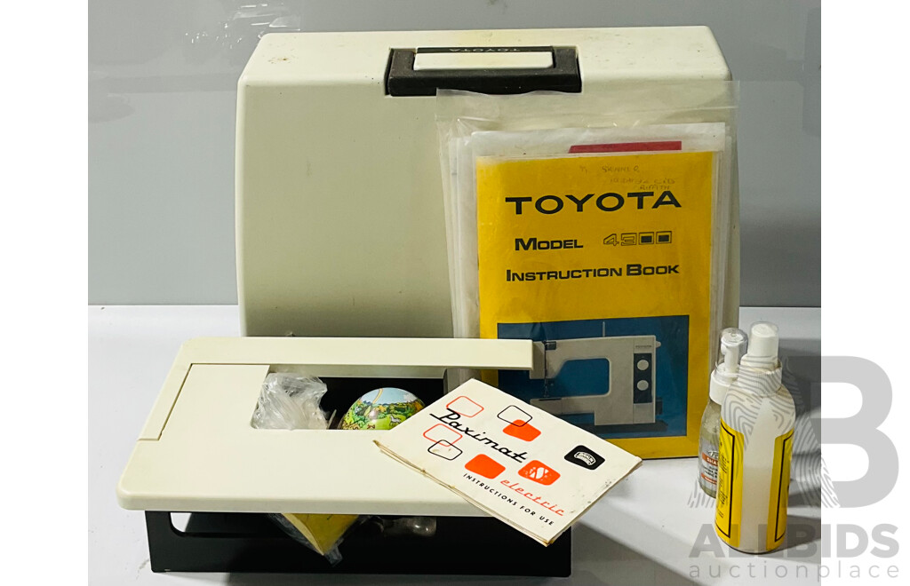 Vintage Toyota Model 4300 Sewing Machine with Electric Foot Pedal, Instruction Booklet, Textile Shampoo and Protector and Several Bobbins, Buttons Etc