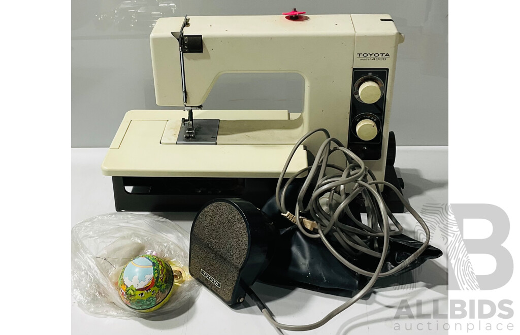 Vintage Toyota Model 4300 Sewing Machine with Electric Foot Pedal, Instruction Booklet, Textile Shampoo and Protector and Several Bobbins, Buttons Etc