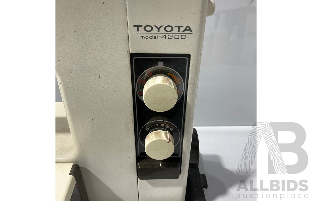 Vintage Toyota Model 4300 Sewing Machine with Electric Foot Pedal, Instruction Booklet, Textile Shampoo and Protector and Several Bobbins, Buttons Etc