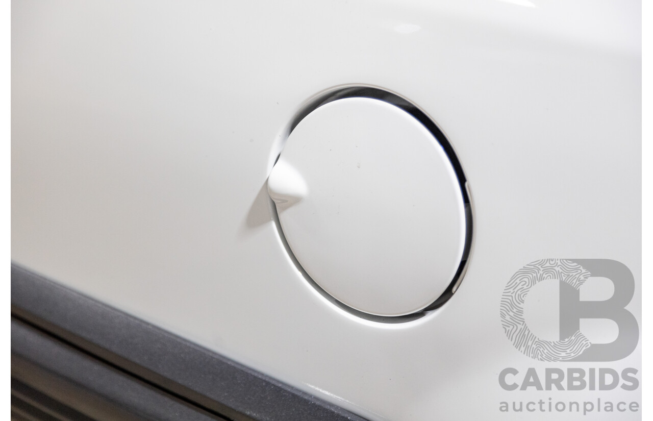 6/1987 Holden Commodore VL Turbo SL BT1 4d Sedan White Turbo 3.0L - Ex-Police - Modified