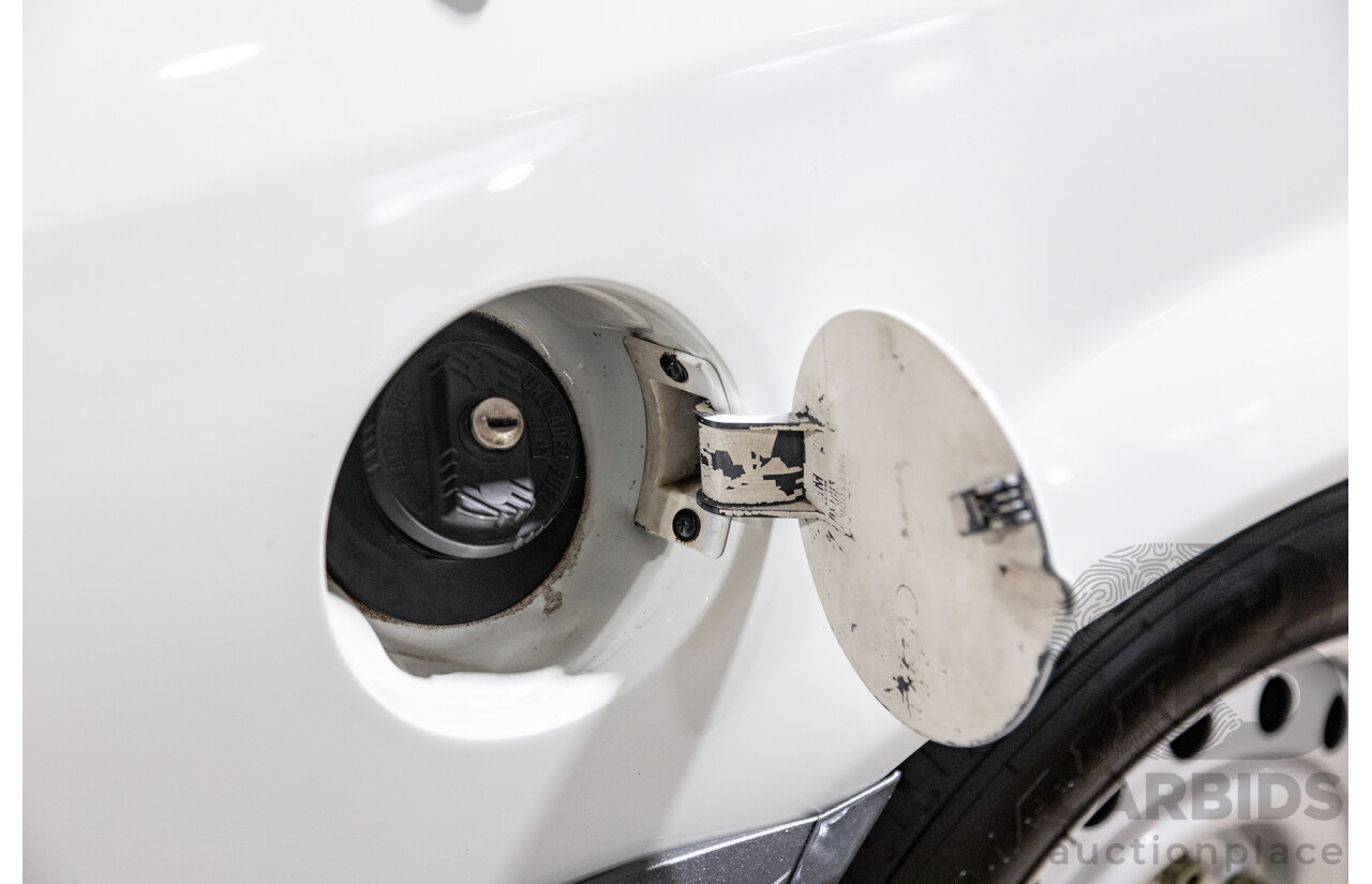 6/1987 Holden Commodore VL Turbo SL BT1 4d Sedan White Turbo 3.0L - Ex-Police - Modified