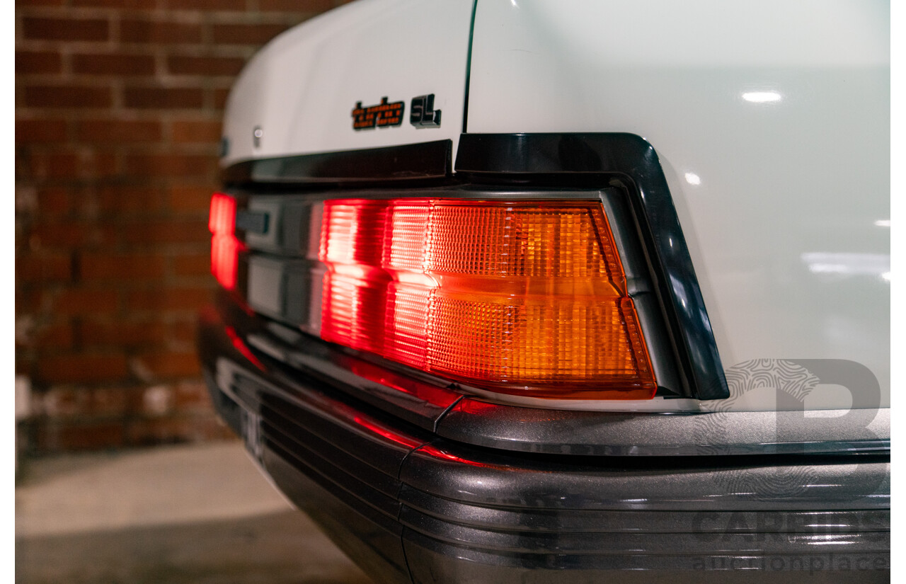 6/1987 Holden Commodore VL Turbo SL BT1 4d Sedan White Turbo 3.0L - Ex-Police - Modified