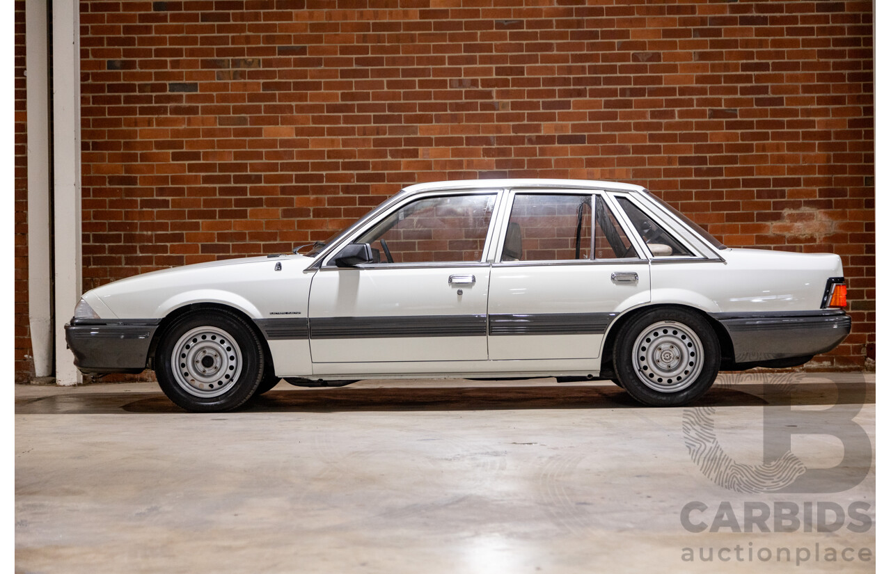 6/1987 Holden Commodore VL Turbo SL BT1 4d Sedan White Turbo 3.0L - Ex-Police - Modified